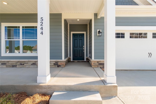 5244 Admirals Lndg, Lancaster, SC 29720 - entrance to property with covered porch, stone siding, and a garage