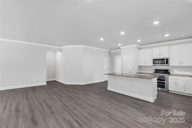 5244 Admirals Lndg, Lancaster, SC 29720 - kitchen featuring appliances with stainless steel finishes, crown molding, a center island, dark wood-type flooring, and recessed lighting
