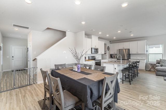 1010 Harry Ct, Albemarle, NC 28001 - dining space with light wood-style floors and recessed lighting
