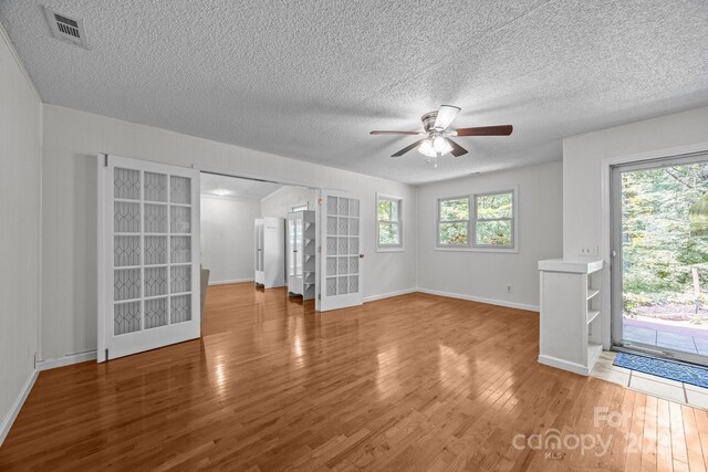 193 Timberside Dr, Mars Hill, NC 28754 - unfurnished room featuring a ceiling fan, wood finished floors, and a textured ceiling