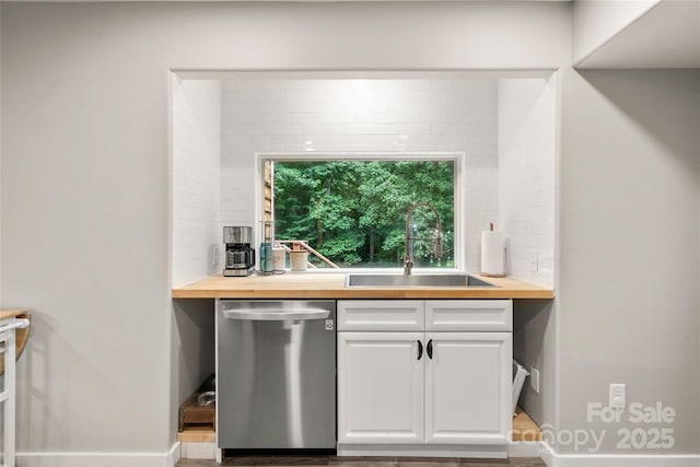 204 Terrys Gap Loop Rd, Fletcher, NC 28732 - kitchen featuring stainless steel dishwasher, wood counters, white cabinets, and wood finished floors