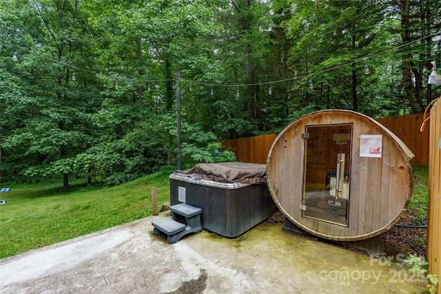 204 Terrys Gap Loop Rd, Fletcher, NC 28732 - view of patio / terrace with a jacuzzi and a forest view