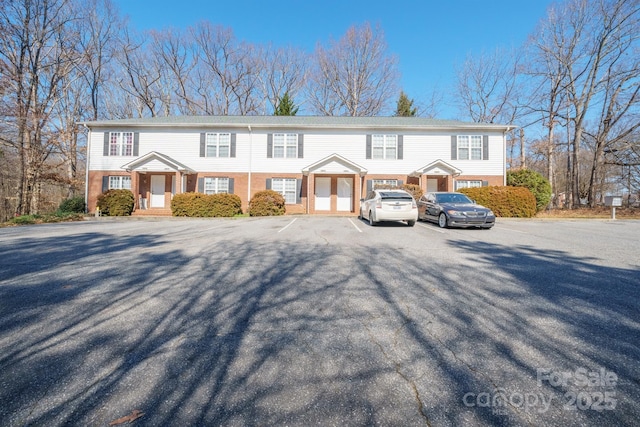 1009 22nd St NE Unit A-E, Hickory, NC 28601 - view of property featuring uncovered parking and brick siding