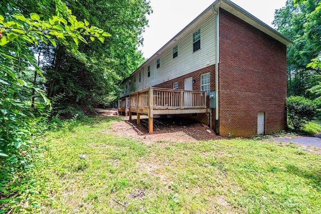 1009 22nd St NE Unit A-E, Hickory, NC 28601 - back of property with a deck, brick siding, and a lawn