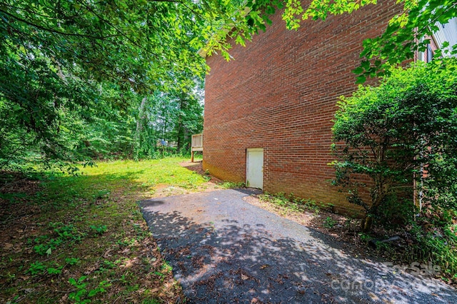 1009 22nd St NE Unit A-E, Hickory, NC 28601 - view of side of property featuring brick siding and a patio area