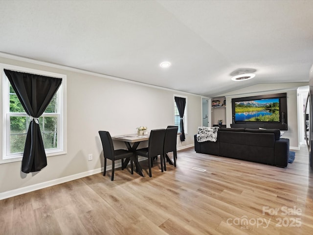1140 Randall Ct, Concord, NC 28025 - dining space with light wood-style flooring and vaulted ceiling