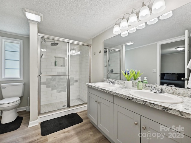 1140 Randall Ct, Concord, NC 28025 - full bathroom featuring ensuite bath, double vanity, a stall shower, wood finished floors, and crown molding