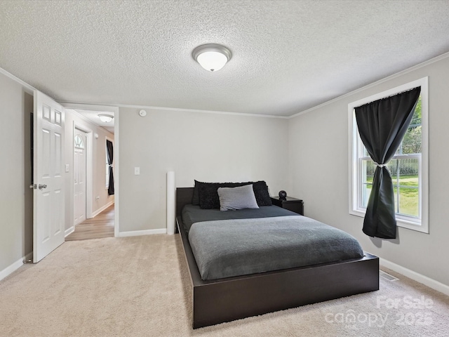 1140 Randall Ct, Concord, NC 28025 - bedroom featuring carpet flooring, ornamental molding, and a textured ceiling