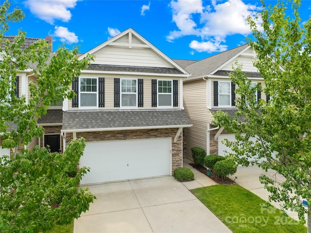 921 Summerlake Dr, Fort Mill, SC 29715 - view of front of house with a garage, concrete driveway, roof with shingles, and stone siding
