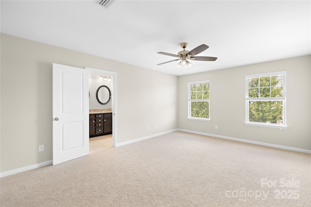 921 Summerlake Dr, Fort Mill, SC 29715 - unfurnished bedroom featuring light colored carpet, ensuite bath, and a ceiling fan
