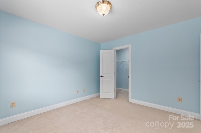 38 Live View Ln, Clyde, NC 28721 - unfurnished bedroom featuring carpet, a spacious closet, and a closet