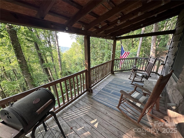 849 Camp Hill Rd, Mill Spring, NC 28756 - wooden terrace with area for grilling and a wooded view