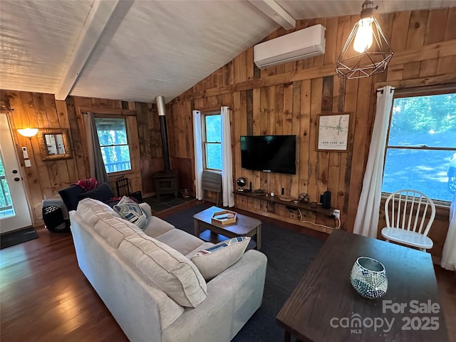 849 Camp Hill Rd, Mill Spring, NC 28756 - living area featuring a wall unit AC, wooden walls, a wood stove, and wood finished floors