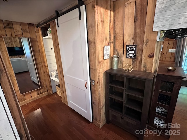 849 Camp Hill Rd, Mill Spring, NC 28756 - hall featuring wood walls, wood finished floors, and a barn door