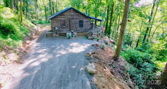849 Camp Hill Rd, Mill Spring, NC 28756 - view of front of property featuring a wooded view and dirt driveway