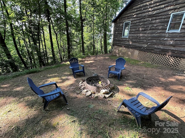 849 Camp Hill Rd, Mill Spring, NC 28756 - view of yard featuring an outdoor fire pit