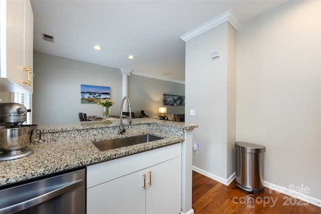 432 W Worthington Ave, Charlotte, NC 28203 - kitchen featuring stainless steel dishwasher, dark wood-style flooring, white cabinets, light stone countertops, and crown molding
