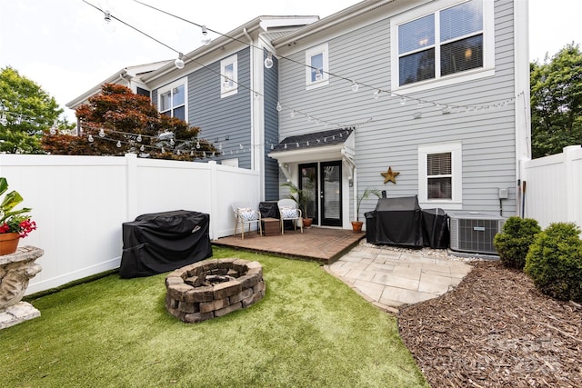 432 W Worthington Ave, Charlotte, NC 28203 - rear view of house featuring a fire pit, a fenced backyard, and a deck
