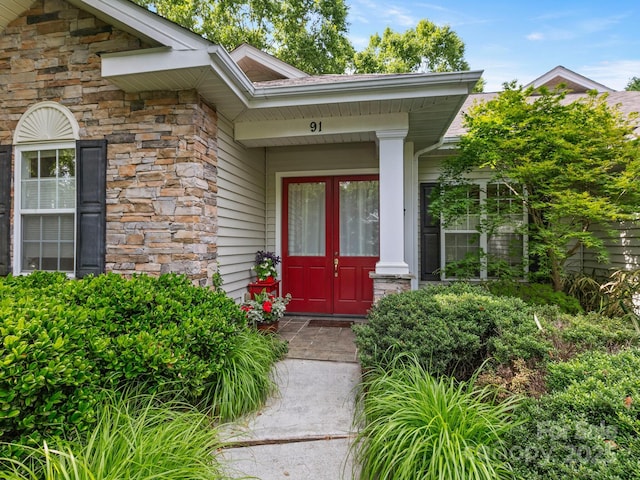 91 Talon Trail Ln, Etowah, NC 28729 - doorway to property with stone siding and french doors