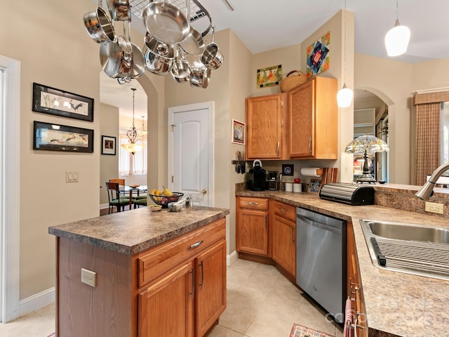 91 Talon Trail Ln, Etowah, NC 28729 - kitchen with stainless steel dishwasher, arched walkways, light tile patterned floors, and a chandelier