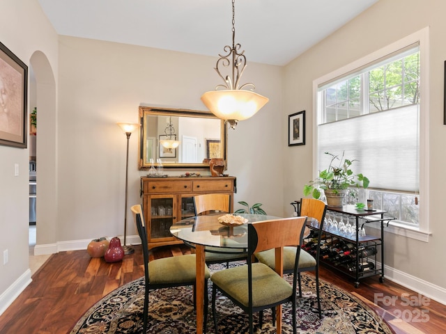 91 Talon Trail Ln, Etowah, NC 28729 - dining area with wood finished floors and arched walkways