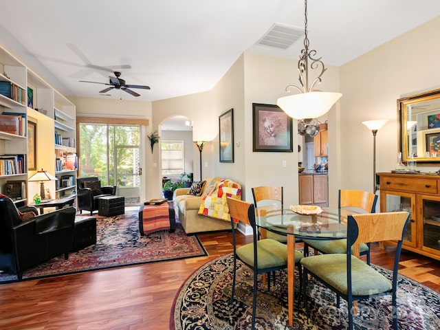 91 Talon Trail Ln, Etowah, NC 28729 - dining space with ceiling fan, arched walkways, and wood finished floors