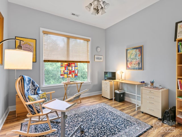 91 Talon Trail Ln, Etowah, NC 28729 - office area with wood finished floors and a chandelier
