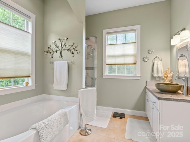 91 Talon Trail Ln, Etowah, NC 28729 - full bath featuring vanity, a garden tub, a shower stall, and tile patterned floors