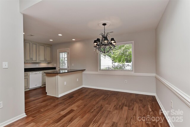 2706 Bremer Ct, Charlotte, NC 28210 - kitchen featuring dishwasher, dark countertops, dark wood-style flooring, a peninsula, and a chandelier