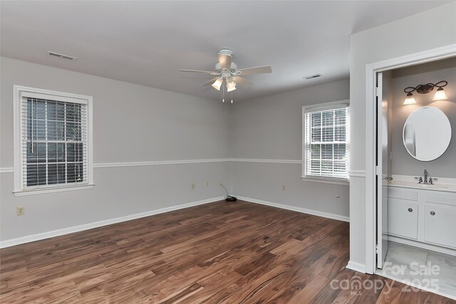 2706 Bremer Ct, Charlotte, NC 28210 - unfurnished bedroom featuring wood finished floors and a sink