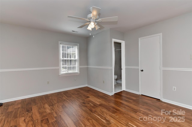 2706 Bremer Ct, Charlotte, NC 28210 - unfurnished bedroom with wood finished floors, ensuite bath, and ceiling fan