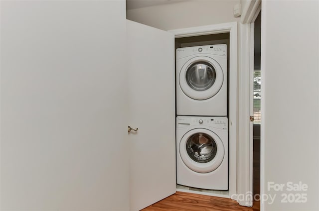 2706 Bremer Ct, Charlotte, NC 28210 - washroom featuring estacked washer and dryer and wood finished floors