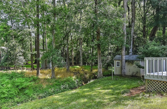 2706 Bremer Ct, Charlotte, NC 28210 - view of green lawn with a wooden deck and a storage shed