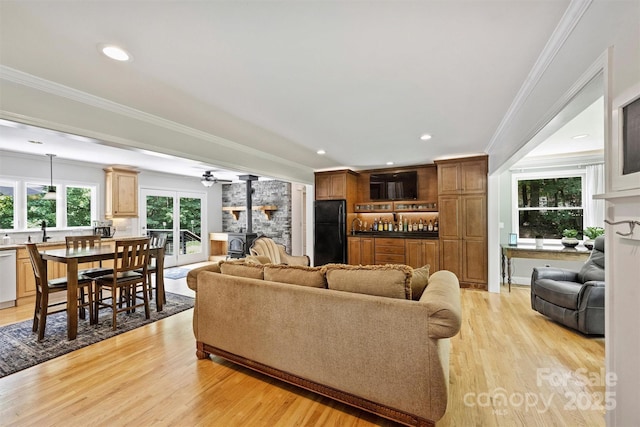 6411 Glenn Teague Rd, Charlotte, NC 28216 - living room with light wood finished floors, crown molding, a fireplace, ceiling fan, and recessed lighting