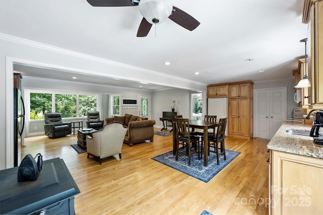 6411 Glenn Teague Rd, Charlotte, NC 28216 - dining room featuring light wood-style flooring, crown molding, recessed lighting, and ceiling fan