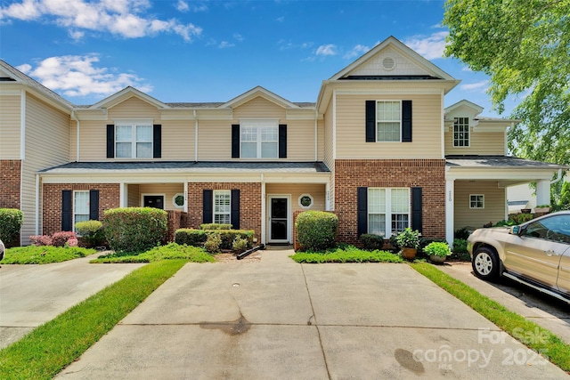 222 Ross Moore Ave, Charlotte, NC 28205 - view of property featuring brick siding and roof with shingles