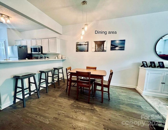 222 Ross Moore Ave, Charlotte, NC 28205 - dining space featuring dark wood-style floors and baseboards