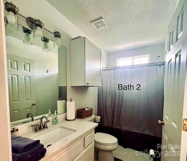 222 Ross Moore Ave, Charlotte, NC 28205 - bathroom featuring vanity, a textured ceiling, and shower / bath combo
