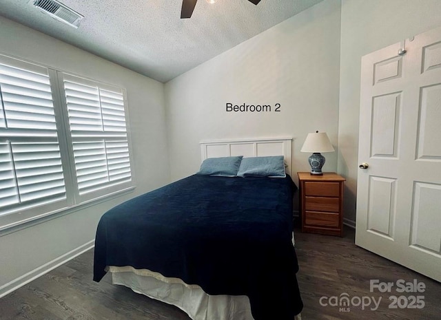 222 Ross Moore Ave, Charlotte, NC 28205 - bedroom with wood finished floors, a textured ceiling, and a ceiling fan