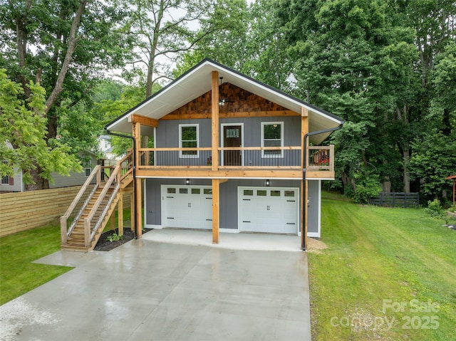 2513 Rolfe St, Hendersonville, NC 28791 - view of front of house with concrete driveway, an attached garage, stairway, and board and batten siding
