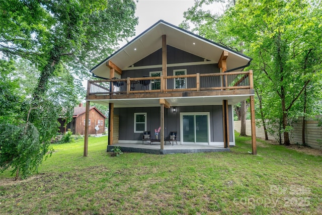 2513 Rolfe St, Hendersonville, NC 28791 - back of house featuring a lawn, board and batten siding, a wooden deck, and a patio