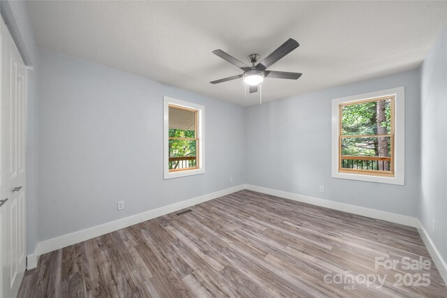 2513 Rolfe St, Hendersonville, NC 28791 - spare room featuring healthy amount of natural light, wood finished floors, and ceiling fan