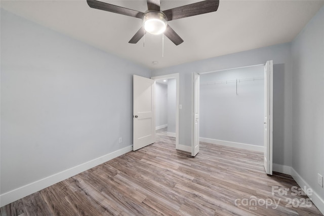 2513 Rolfe St, Hendersonville, NC 28791 - unfurnished bedroom featuring wood finished floors, ceiling fan, and a closet