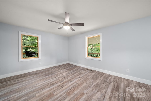 2513 Rolfe St, Hendersonville, NC 28791 - spare room with healthy amount of natural light, wood finished floors, and ceiling fan