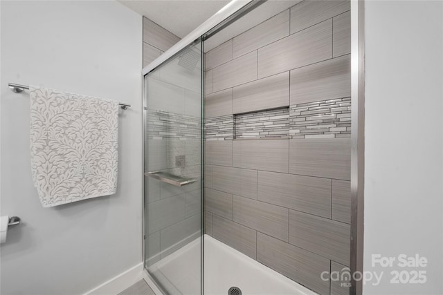 2513 Rolfe St, Hendersonville, NC 28791 - full bathroom with a stall shower and baseboards