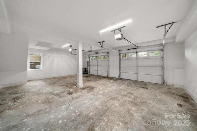2513 Rolfe St, Hendersonville, NC 28791 - garage featuring a garage door opener and baseboards