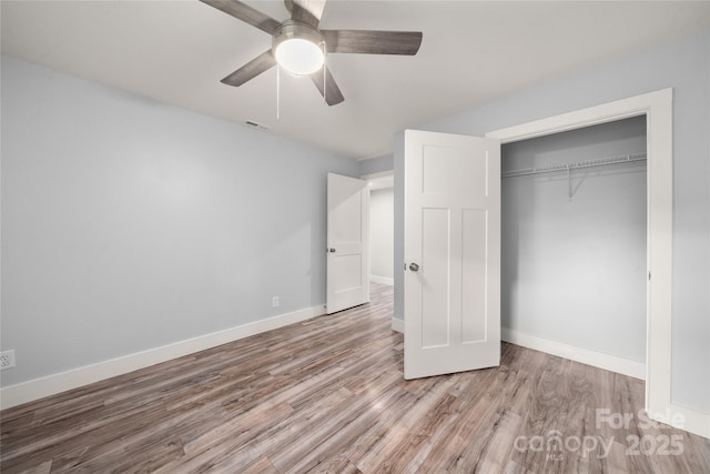 2513 Rolfe St, Hendersonville, NC 28791 - unfurnished bedroom featuring wood finished floors, a closet, and ceiling fan