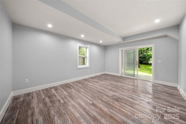 2513 Rolfe St, Hendersonville, NC 28791 - unfurnished room with wood finished floors, healthy amount of natural light, and recessed lighting