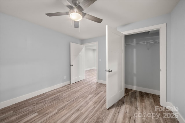 2513 Rolfe St, Hendersonville, NC 28791 - unfurnished bedroom with wood finished floors, a closet, and a ceiling fan