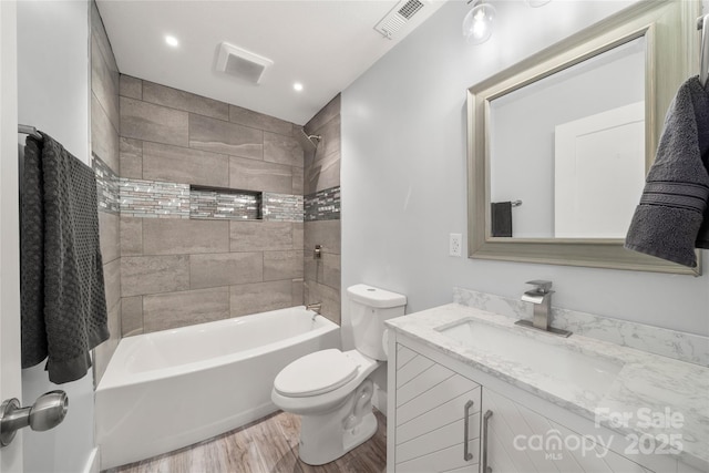 2513 Rolfe St, Hendersonville, NC 28791 - full bathroom with wood finished floors, vanity, shower / bath combination, and recessed lighting